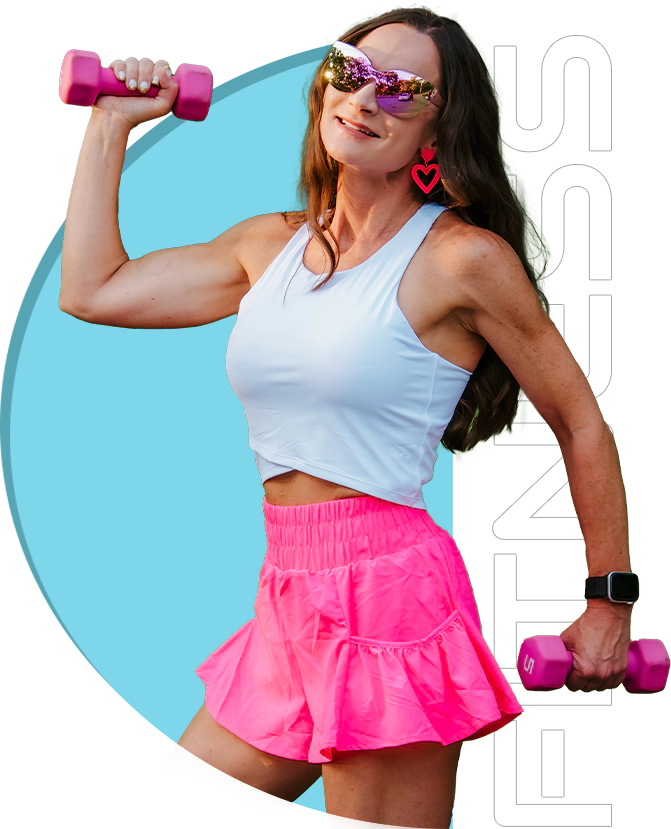 A woman in pink shorts and white top holding two dumbbells.