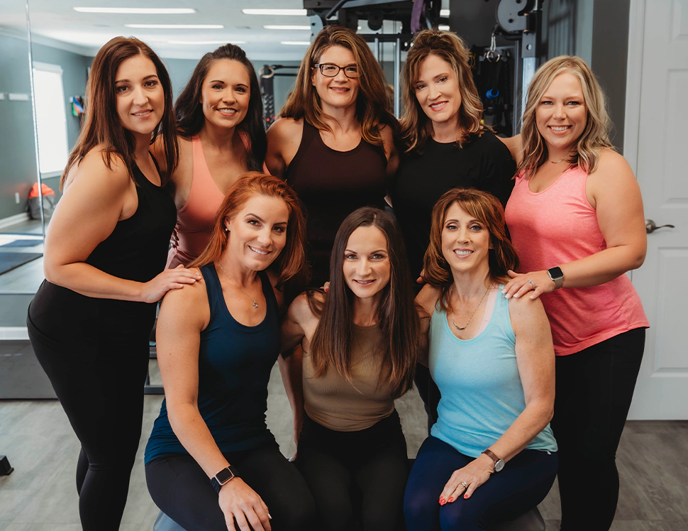 A group of women posing for a picture.