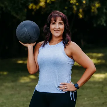 A woman holding a ball in her hand.